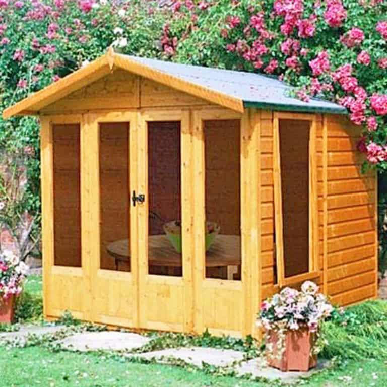 7'3 x 7'11 Shire Parham wooden garden summerhouse with large windows and a stylish design for outdoor relaxation.