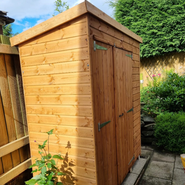 Bards 6' x 3' Handy Pent Storage Shed enclosed in a garden setting.