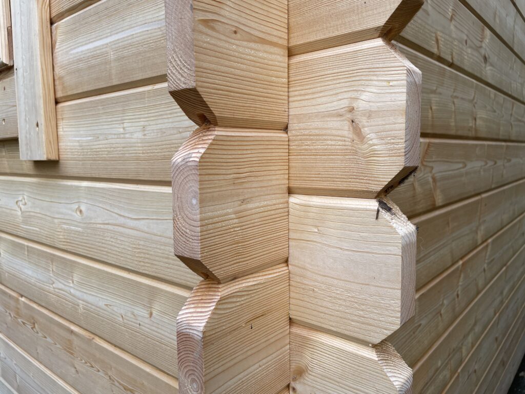 Close-up of corner joints in a wooden garden building