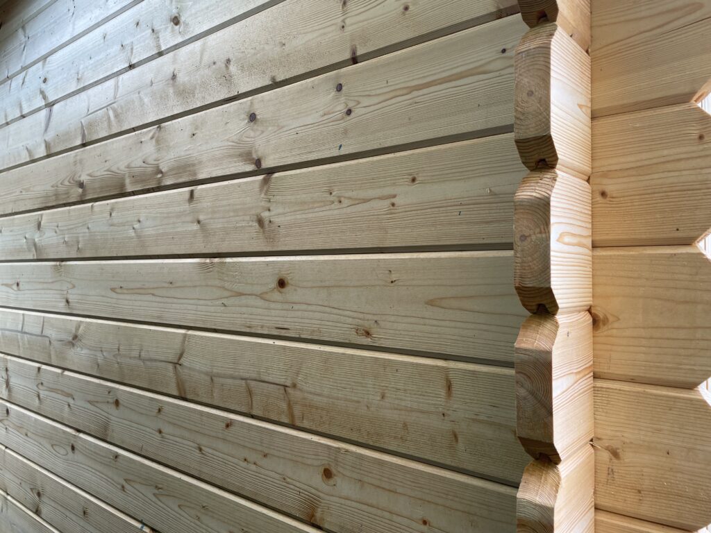 Close-up of corner joints in a wooden garden building