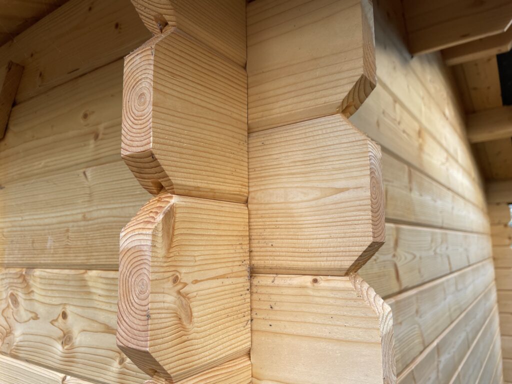 Close-up of corner joints in a wooden garden building