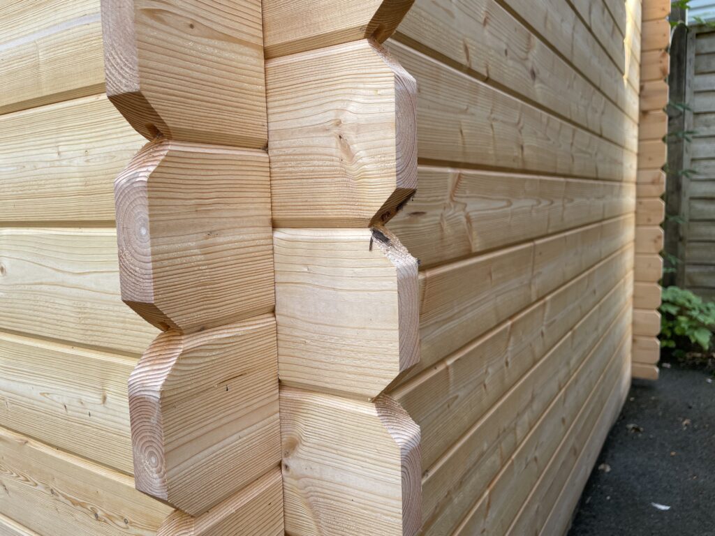 Close-up of corner joints in a wooden garden building