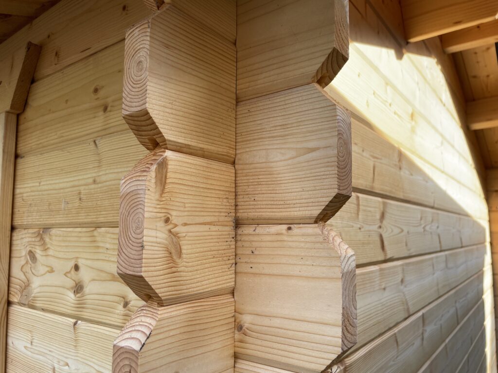 Close-up of corner joints in a wooden garden building