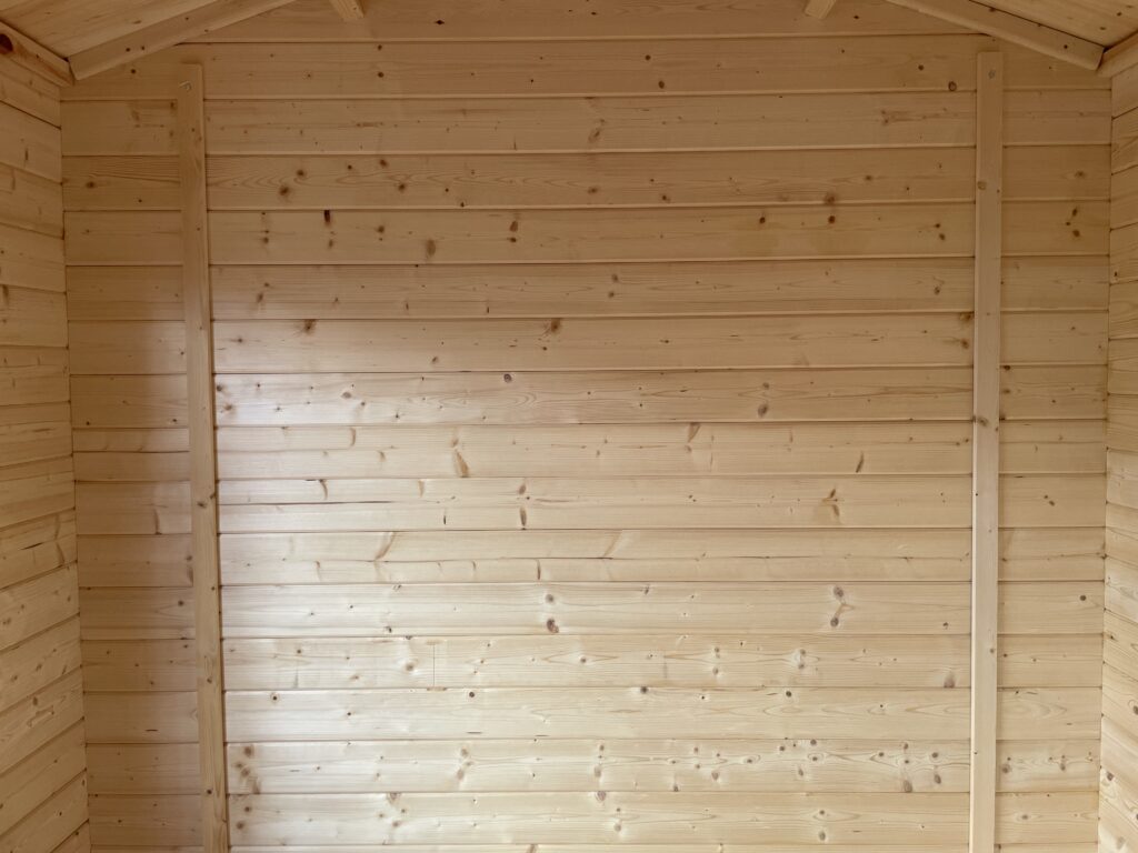 Interior view of timber walls in a garden building