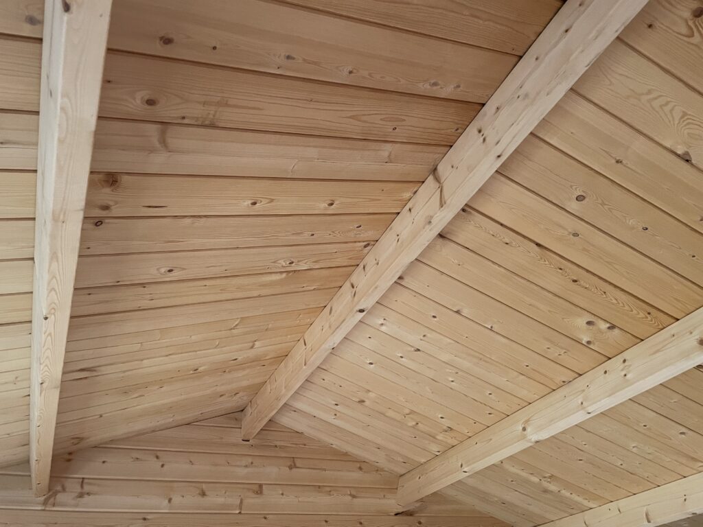 Apex roof interior showcasing timber beams and cladding