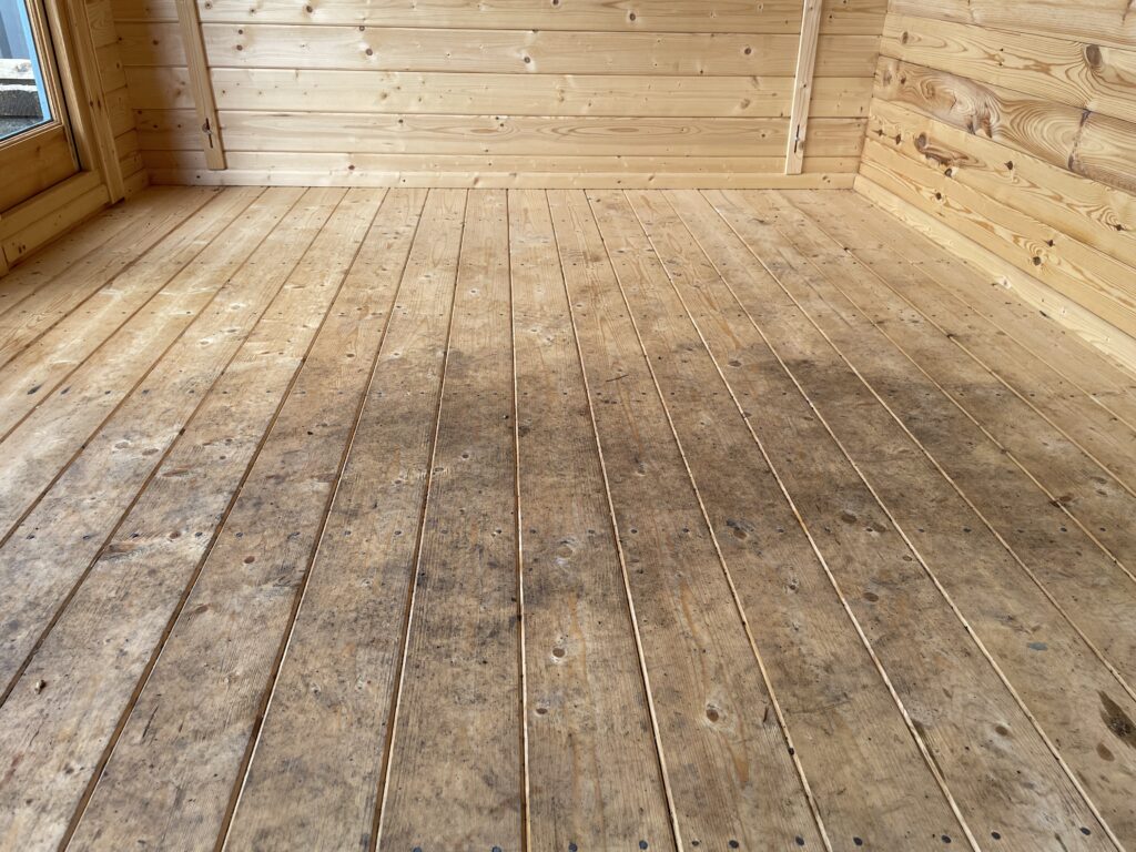 Interior floor of a garden building showing wooden planks
