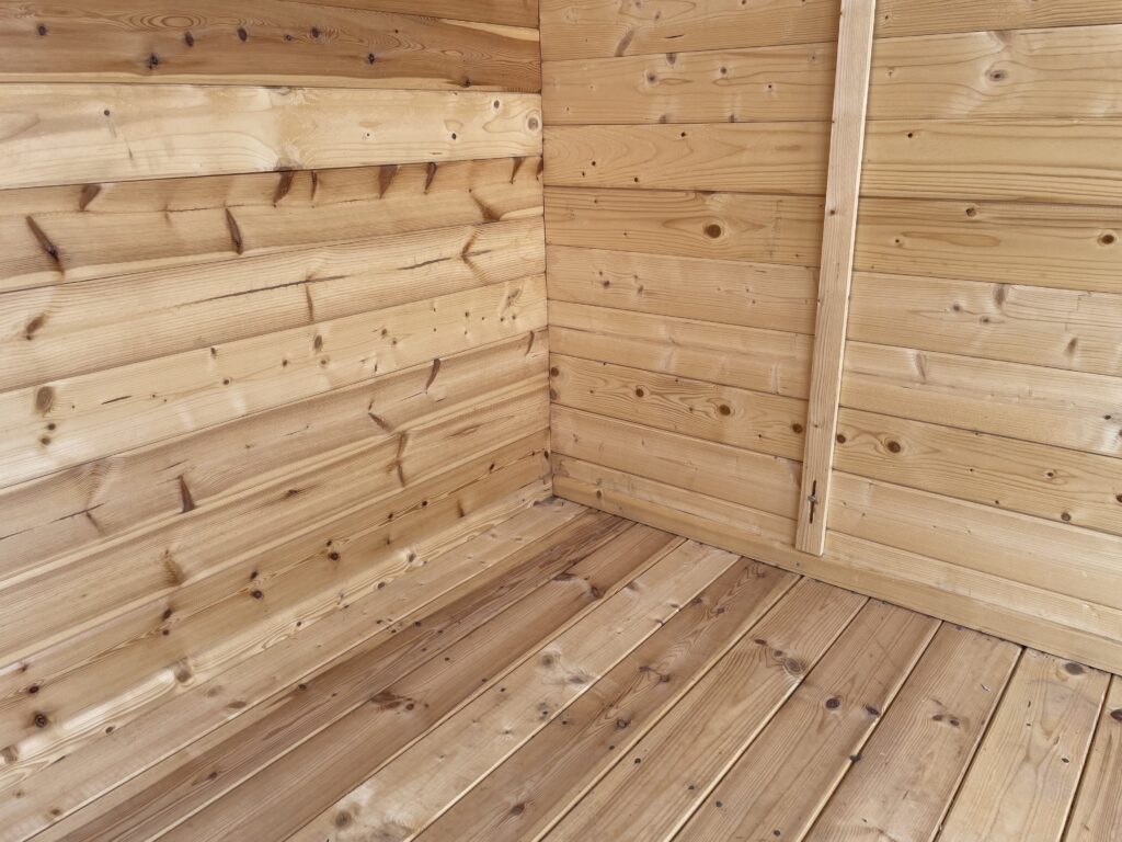 Interior view of a wooden floor in a garden building