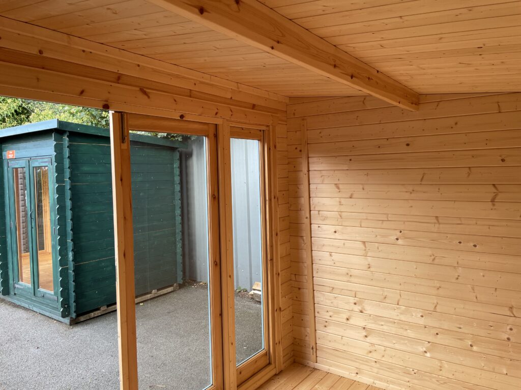 Interior view showcasing full-pane windows and wooden walls