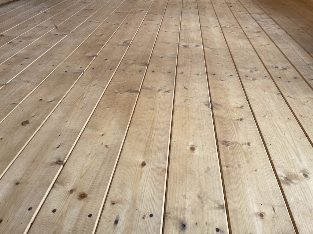 Timber floor showcasing 44mm thick planks with natural knots
