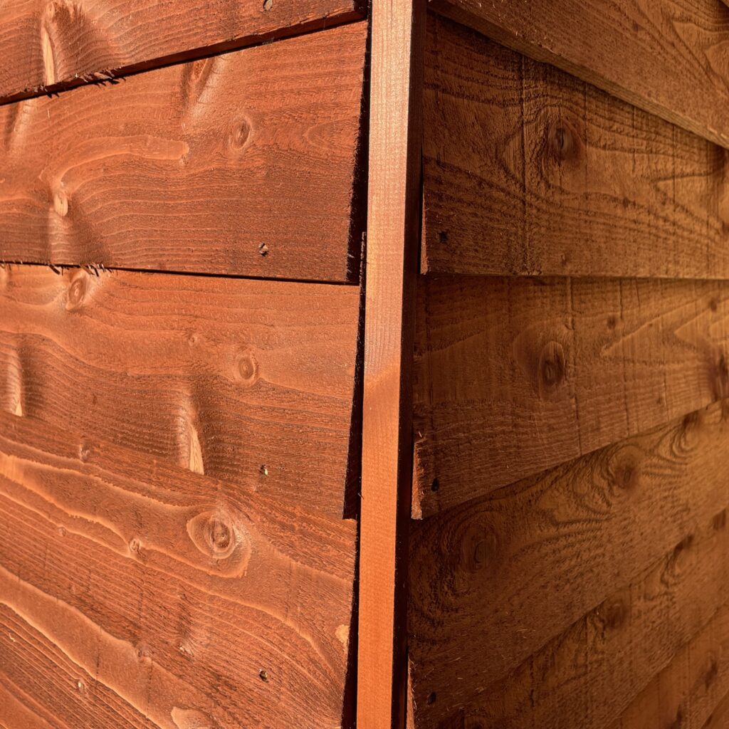 Detailed view of overlapping wooden cladding showcasing craftsmanship