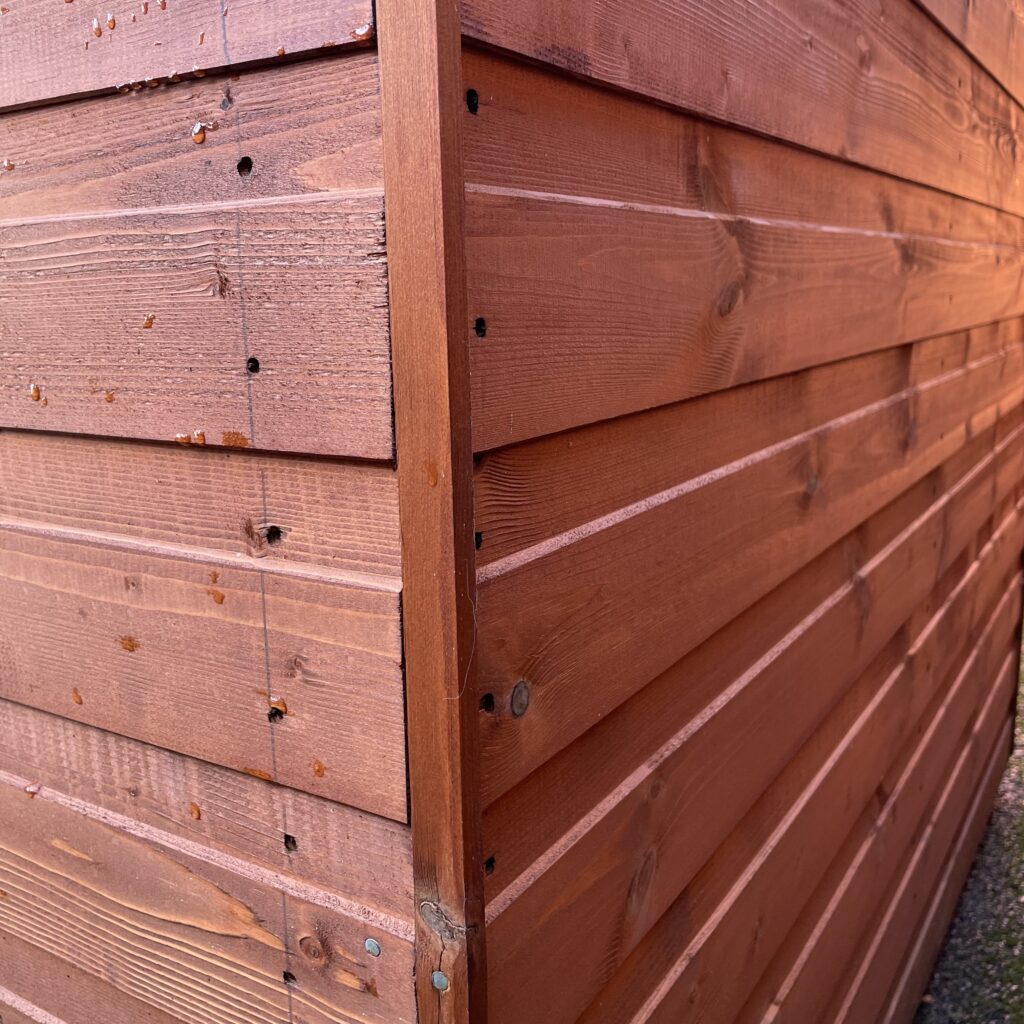 Corner joints of a wooden garden building showcasing high-quality craftsmanship