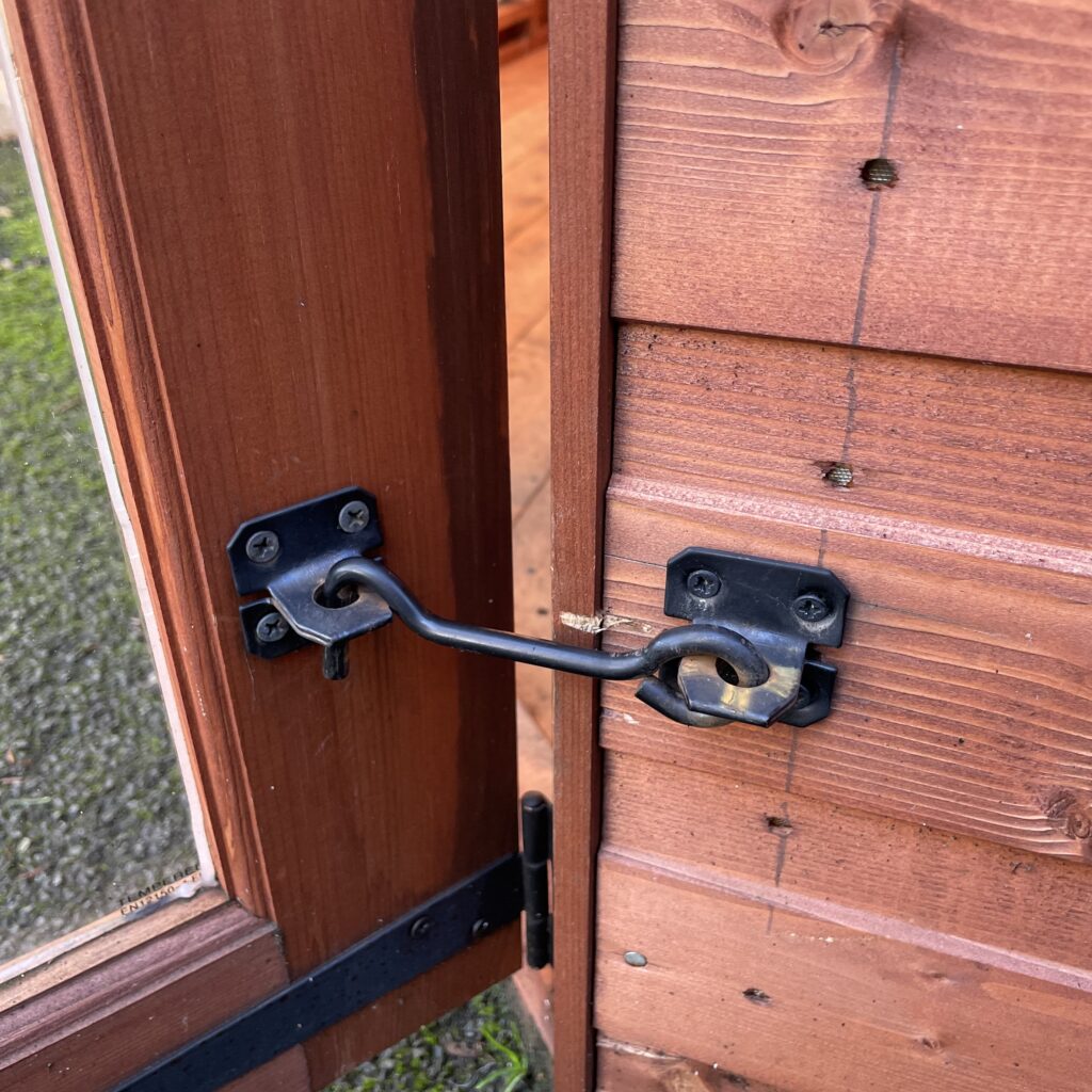 Close-up of the latch mechanism on the Tiger Corner Summerhouse door