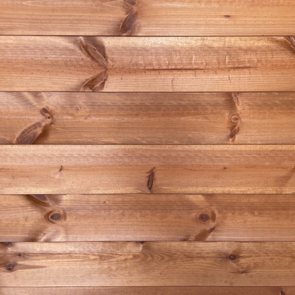 Close-up of wooden cladding panels showcasing natural grain and texture