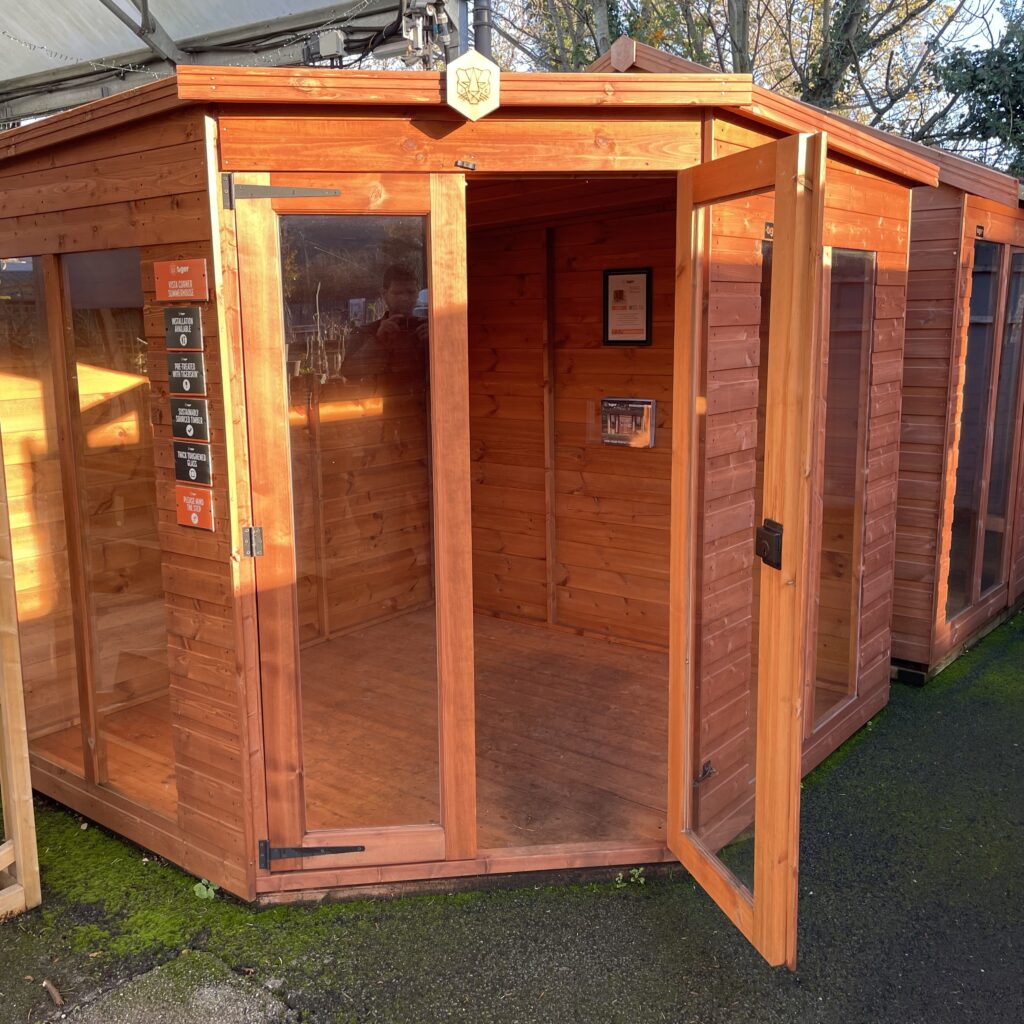 Tiger Corner Summerhouse featuring large windows and an open door