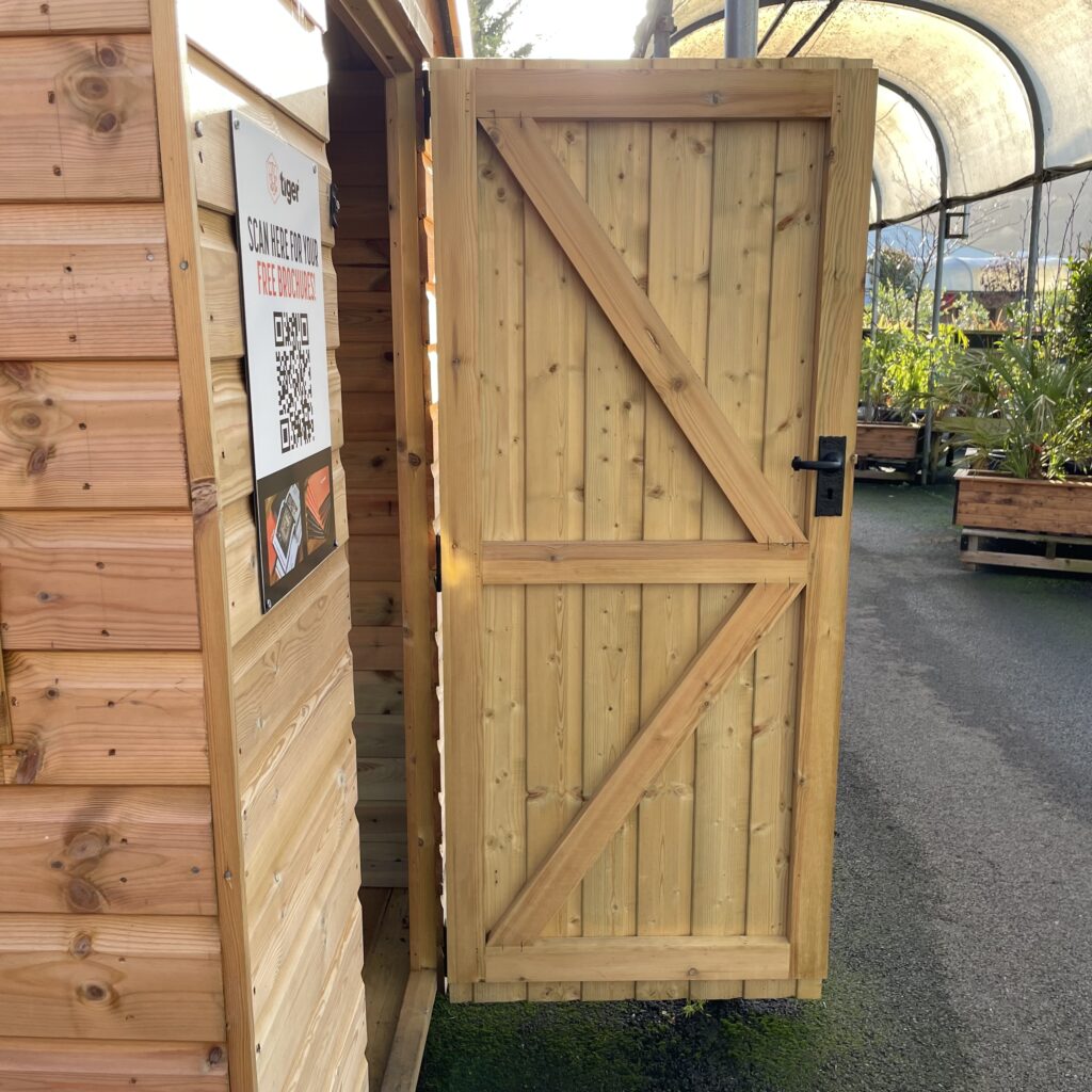 Apex shed door with sturdy wooden construction and latch