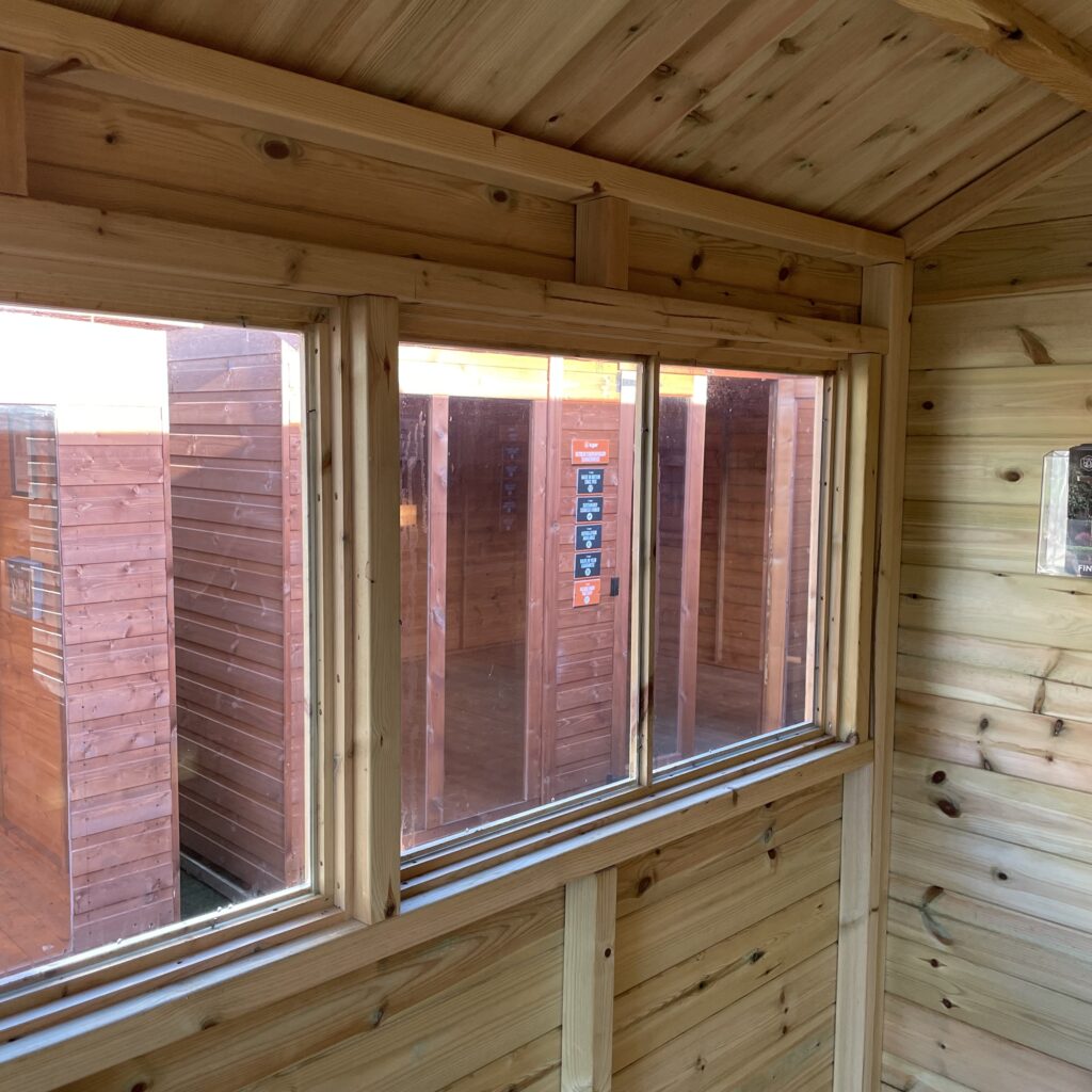 Interior view of a Tiger Elite Apex Shed showcasing large windows