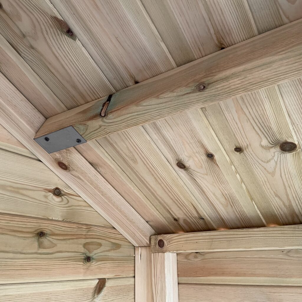 Interior view of apex shed roof structure with timber beams