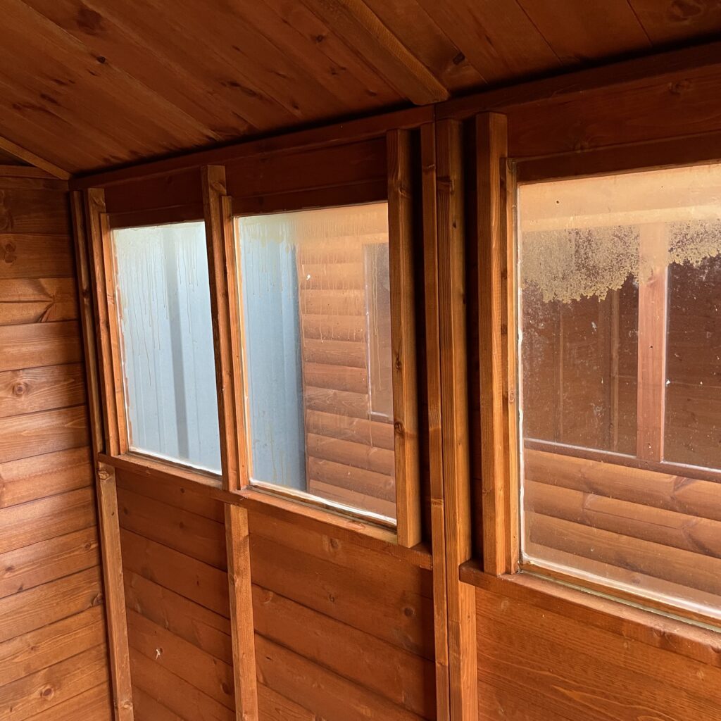 Interior view showcasing wooden walls and toughened glass windows