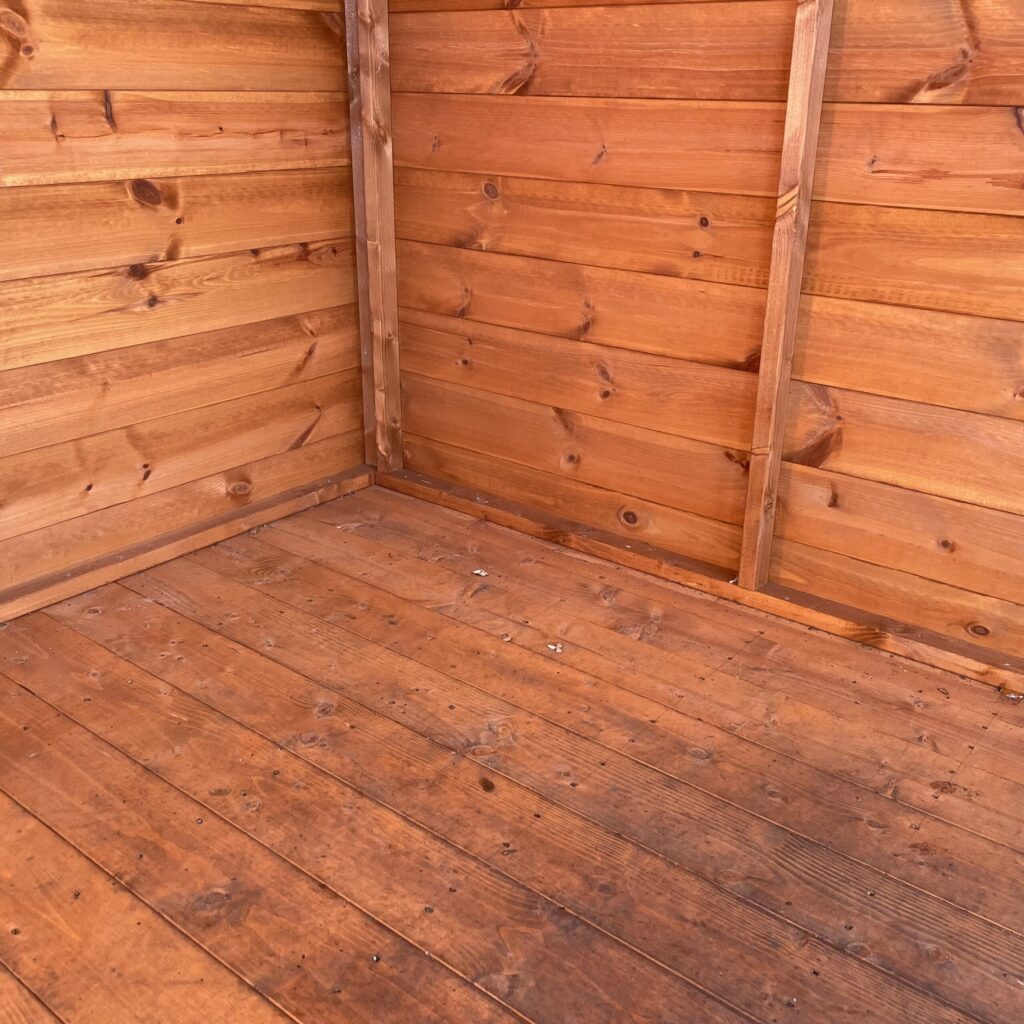 Interior view of a wooden floor with solid cladding