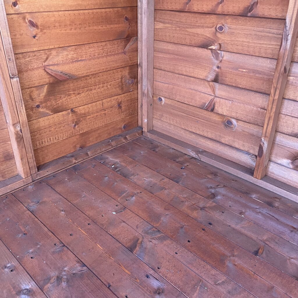 Interior view of a wooden floor in a garden building