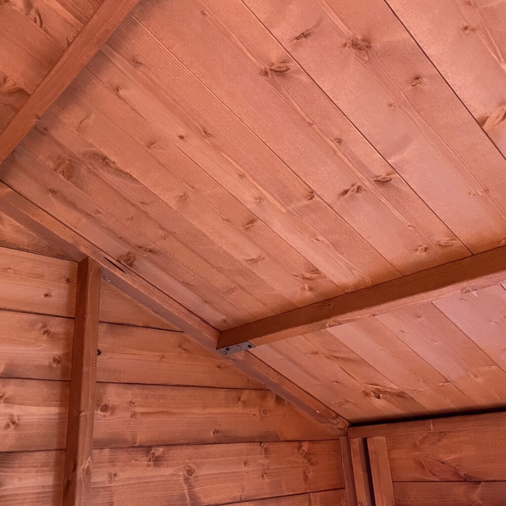 Interior ceiling view of a wooden garden building