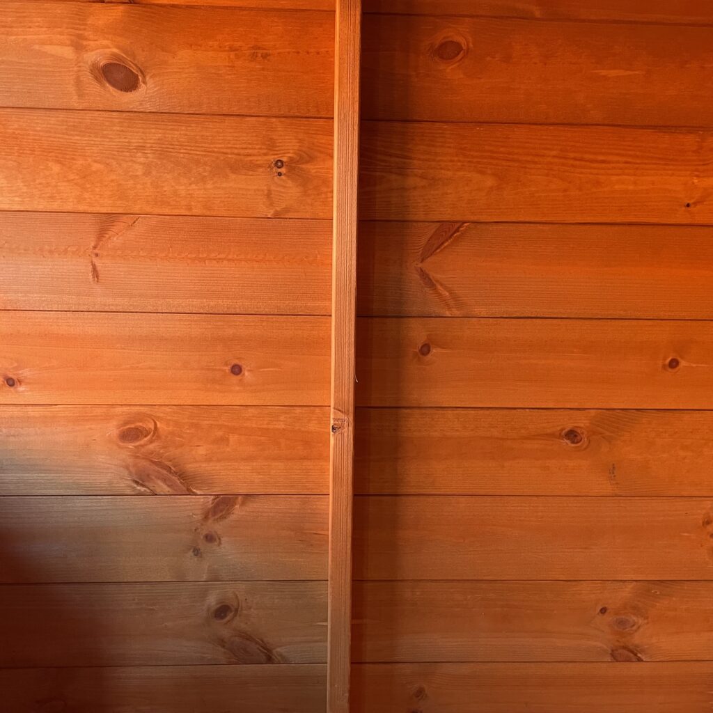 Interior view showcasing overlapping wooden cladding