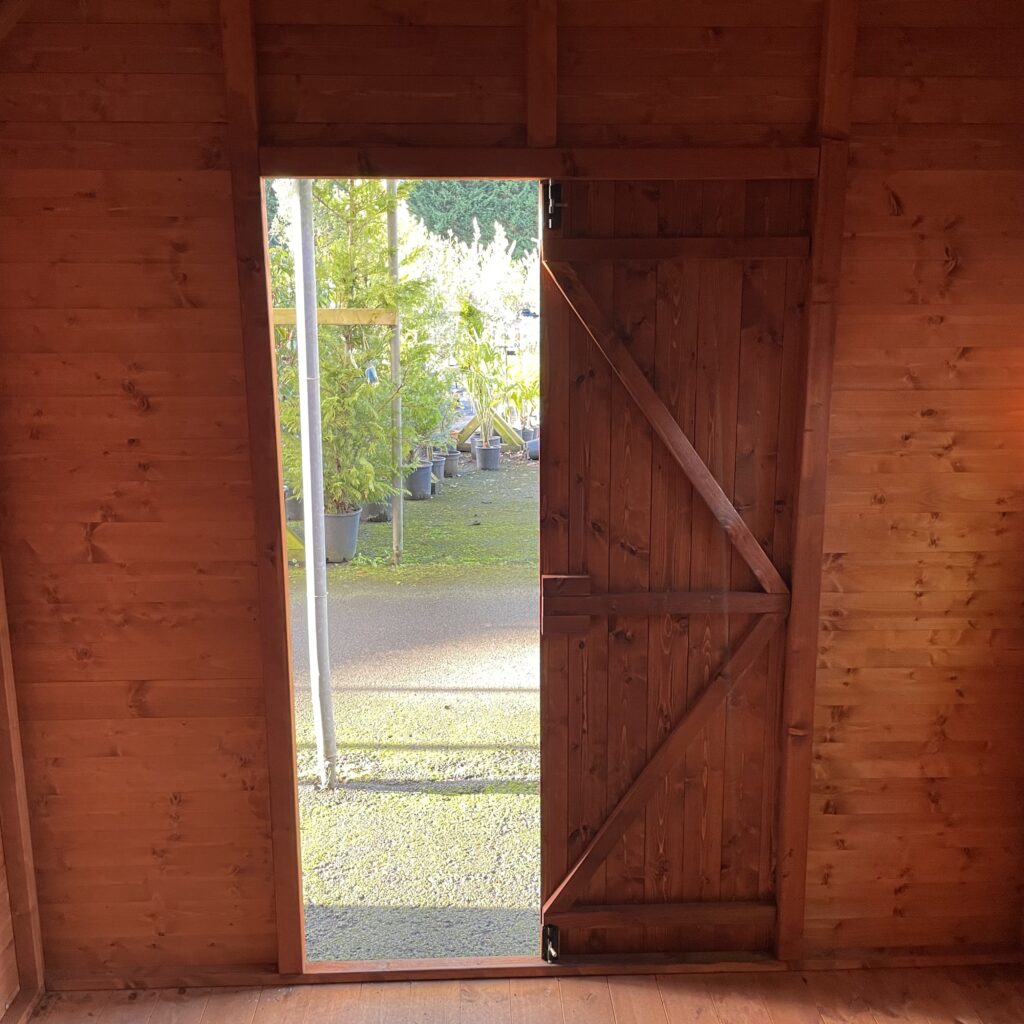 Interior view of the Tiger Loglap Mini-Barn with open door