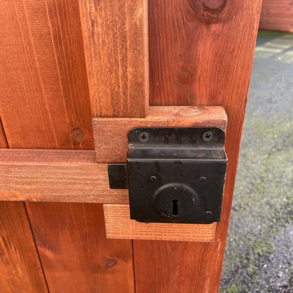 Lock mechanism on a wooden shed door