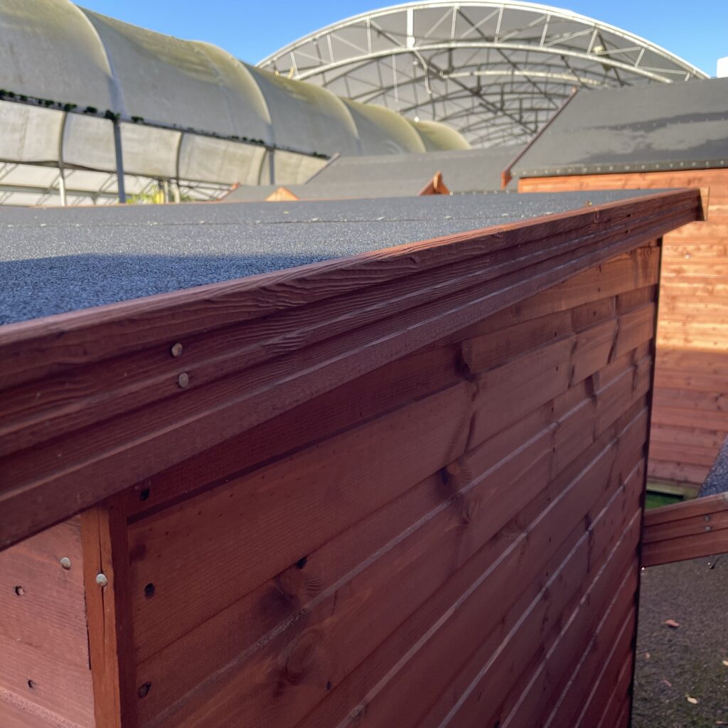 Close-up of the pent roof and cladding of a Tiger Pent Bike Shed