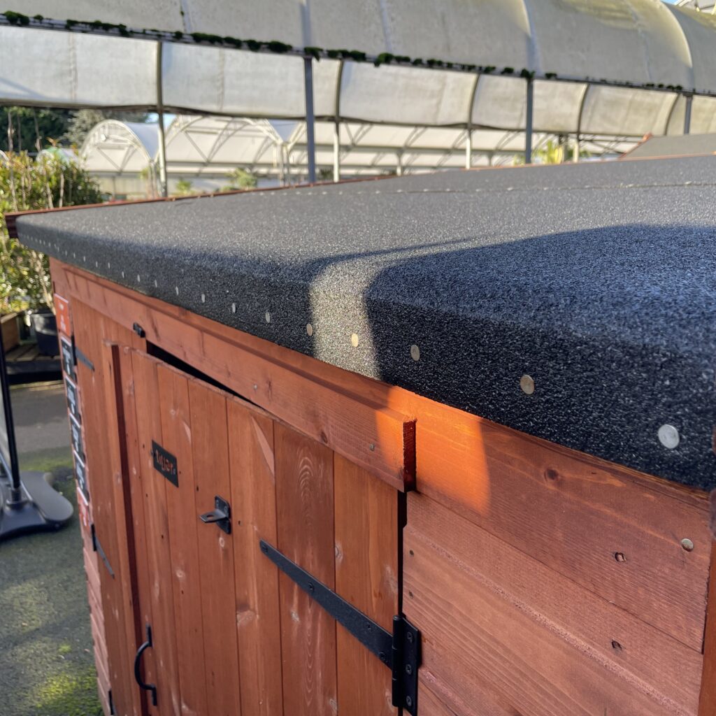 Pent roof and wooden door of the Tiger Pent Bike Shed