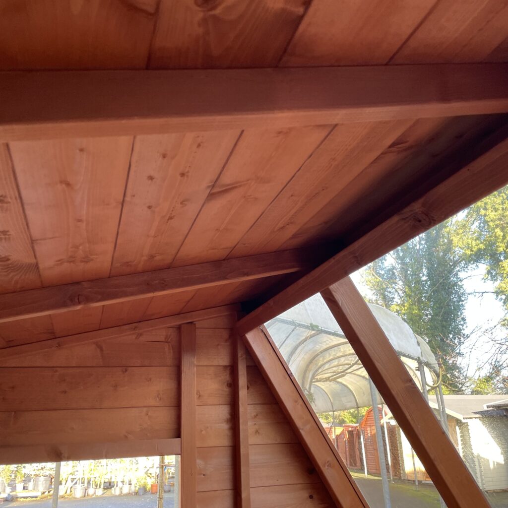 Interior view of the Tiger Potting Shed with wooden beams and ceiling