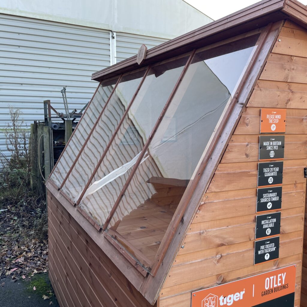 Tiger Potting Shed with large windows and wooden cladding