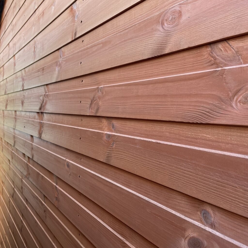 Close-up of the wooden cladding on the Tiger Retreat Contemporary Summerhouse