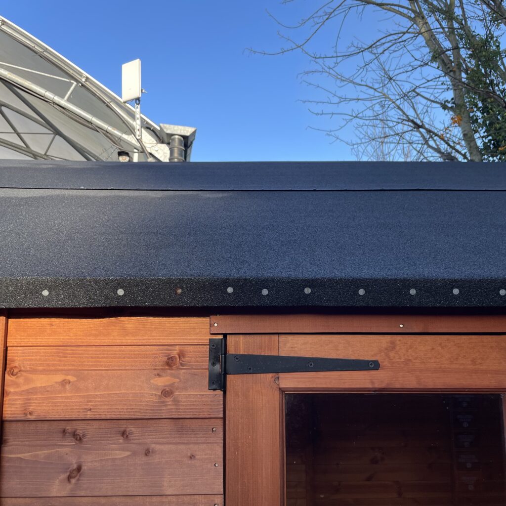 Flat roof of a Tiger Retreat Contemporary Summerhouse with timber cladding