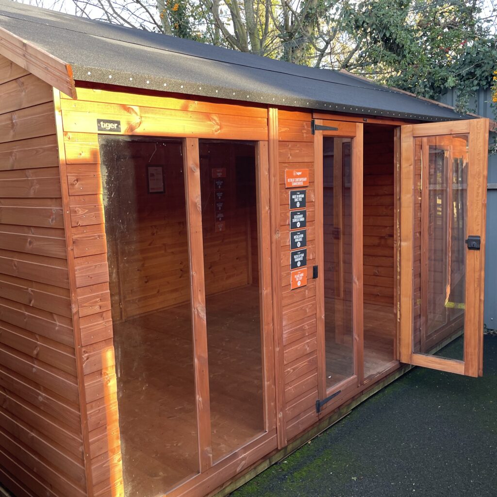 Contemporary summerhouse featuring double doors and full-height windows