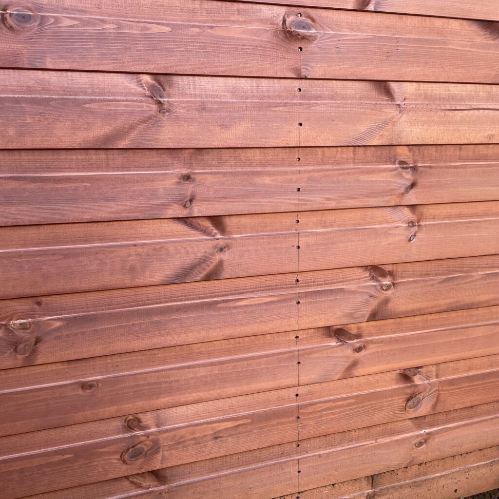 Close-up of Tiger Shiplap Apex Shed's shiplap cladding showing smooth finish