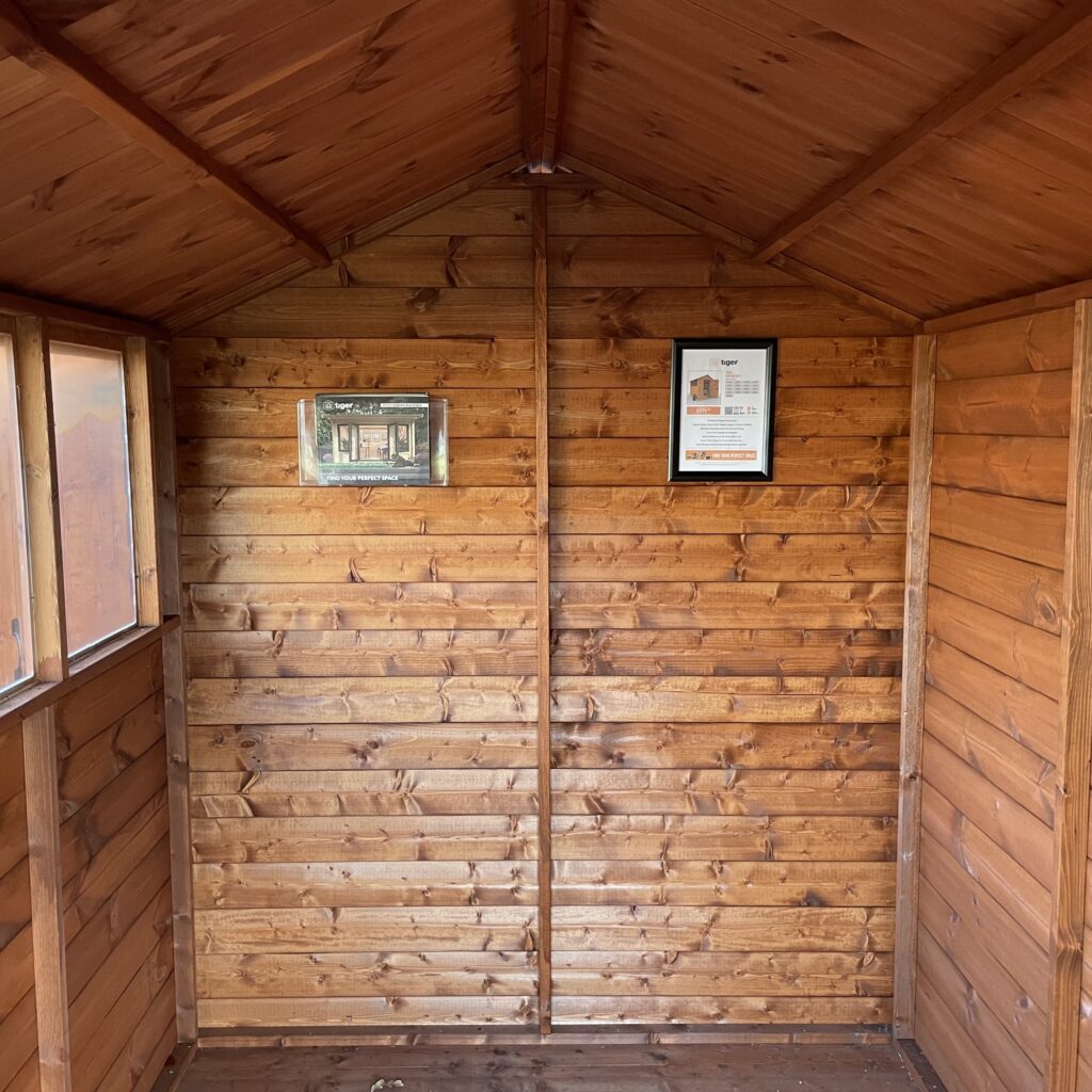Interior view of a Tiger Shiplap Apex Shed with wooden walls