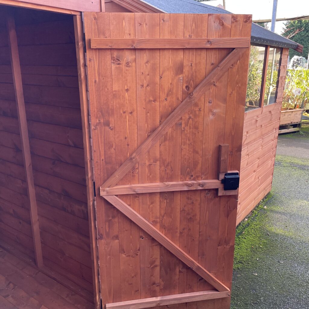 Pent shed door with robust construction and secure lock