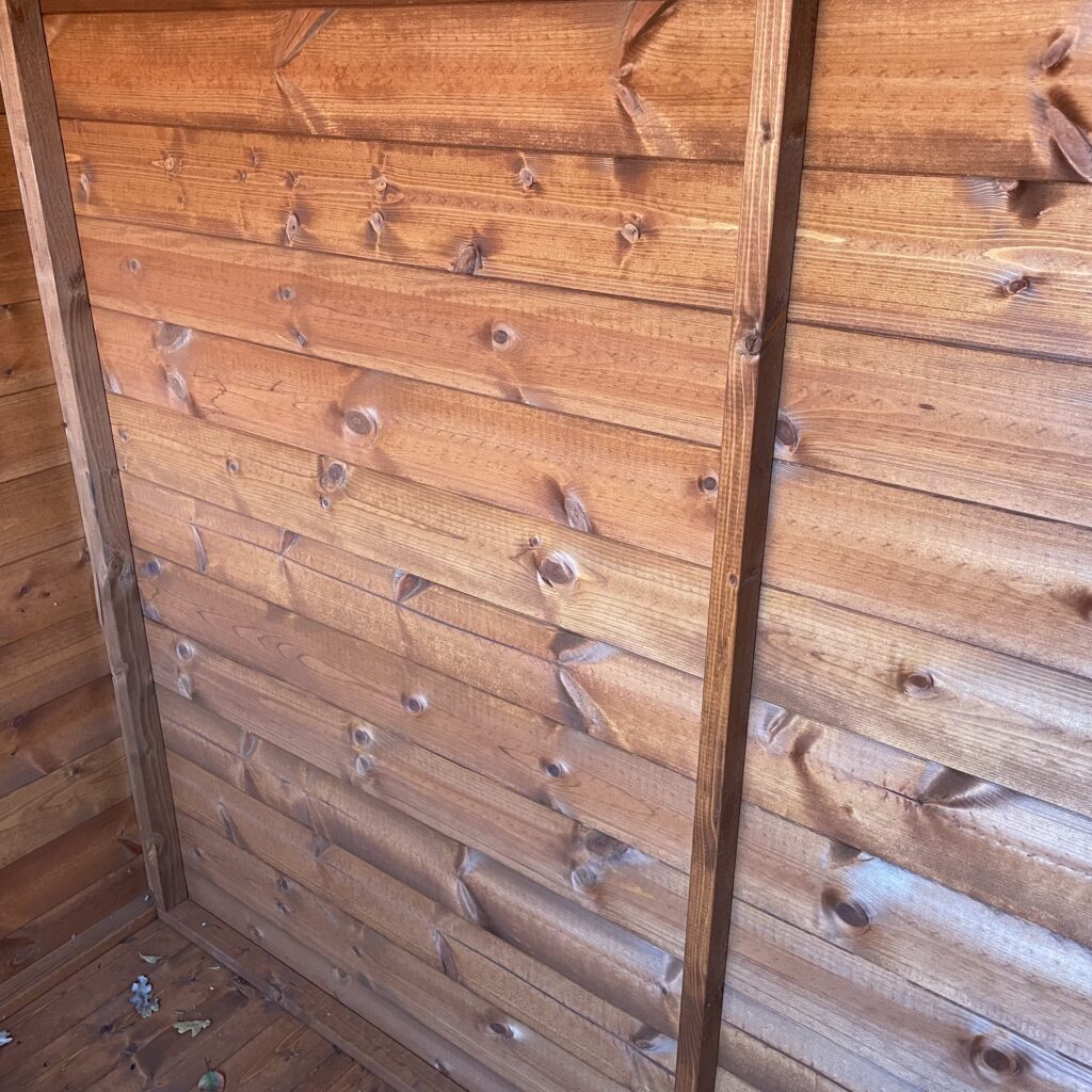 Interior wall of a Tiger Shiplap Pent Shed showing shiplap cladding