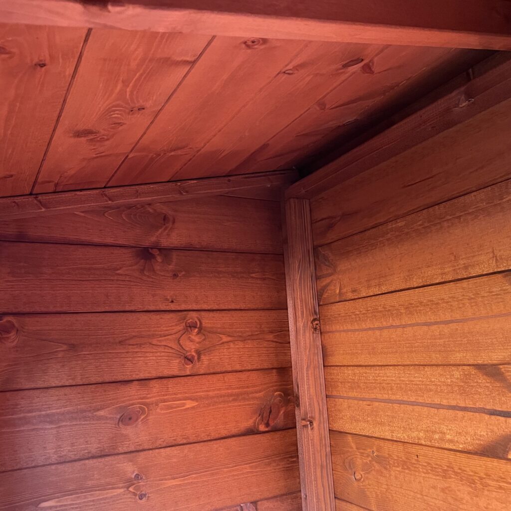 Interior corner of a Tiger Storbox showing wooden panels and joinery