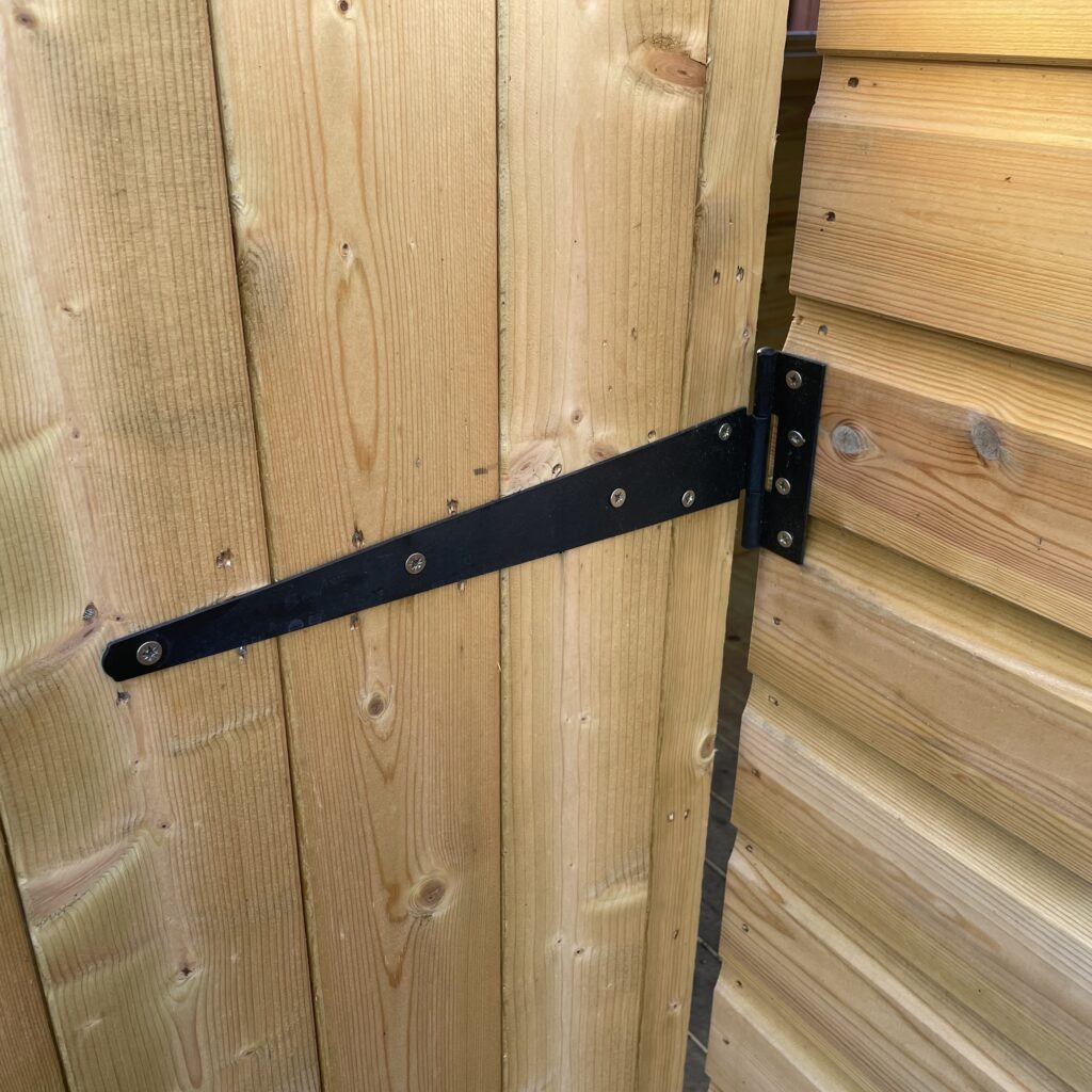 Timber door with black hardware detailing