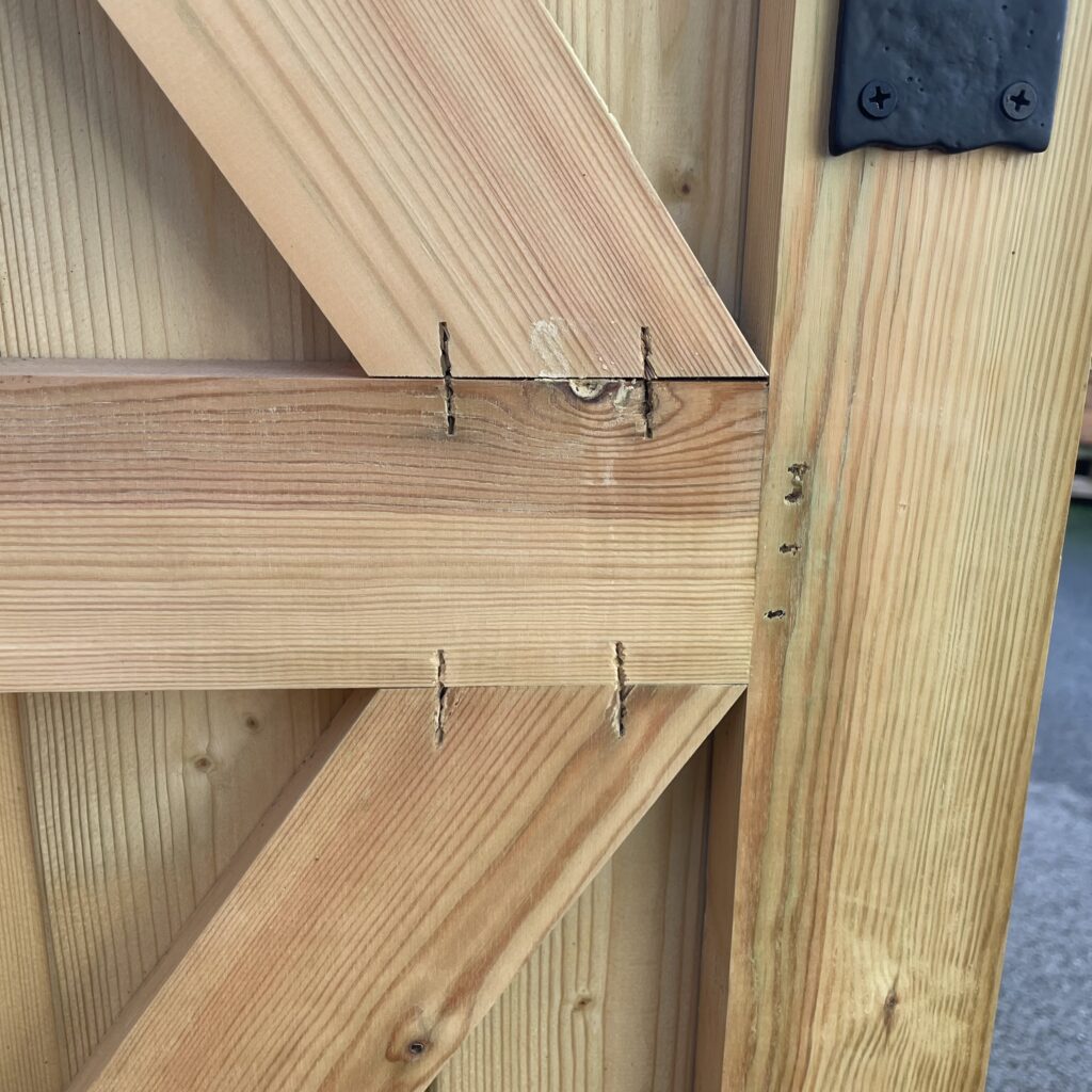 Close-up of a timber door joint showcasing craftsmanship
