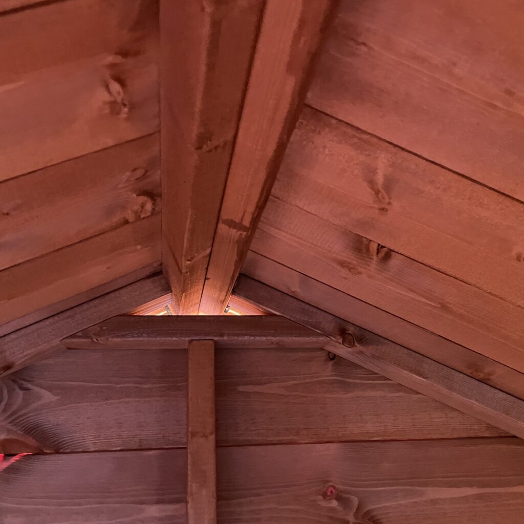 Interior view of a timber building apex with structural beams