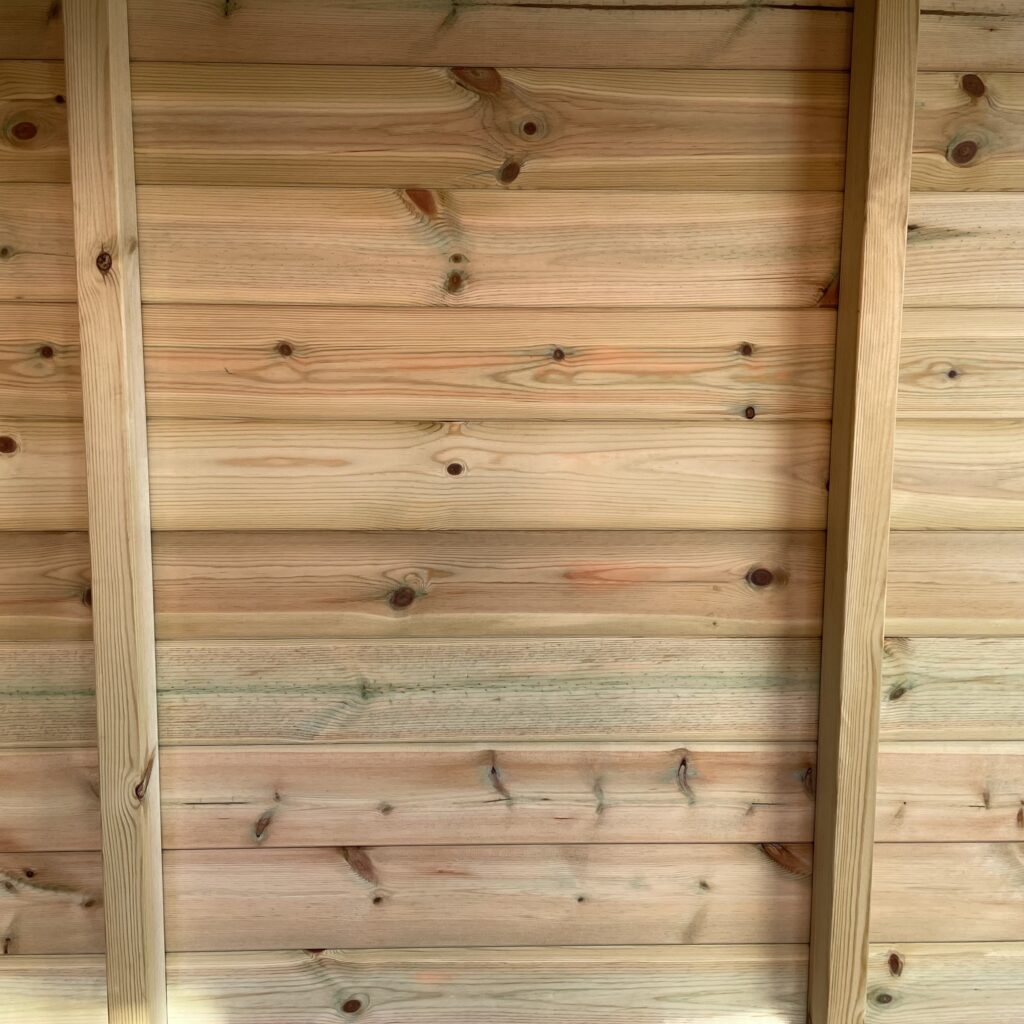 Interior view showcasing timber cladding and vertical supports