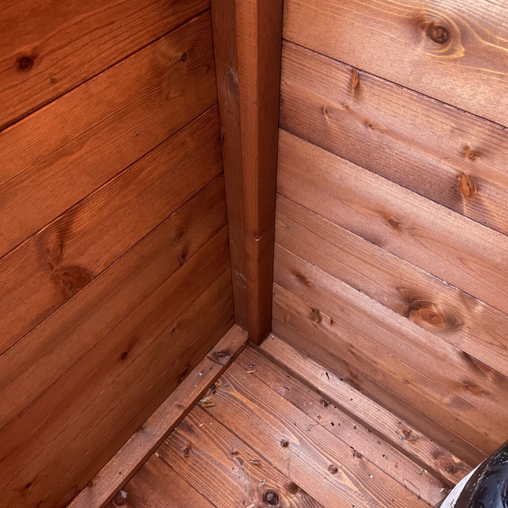 Interior corner of a Tiger wooden tool chest showcasing wood grain and joinery