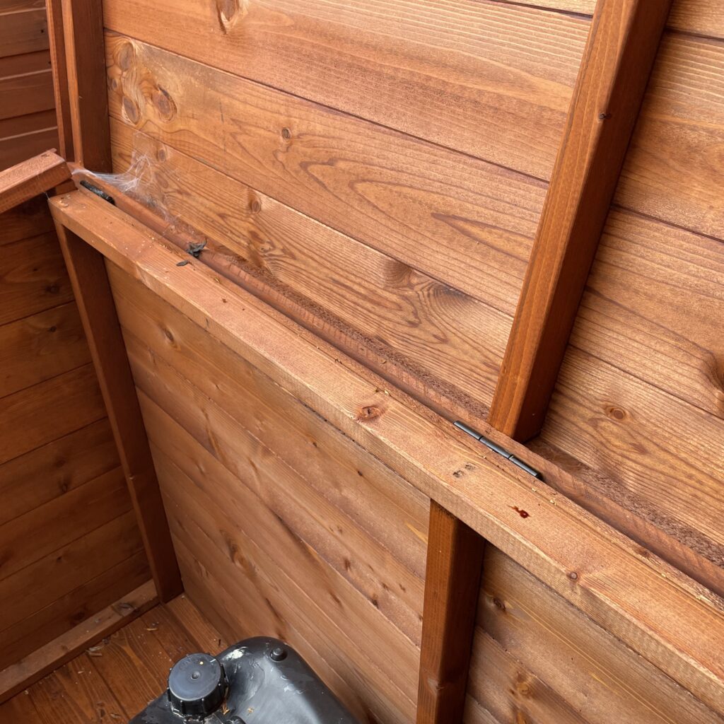 Interior view of a Tiger wooden tool chest showcasing the cladding and hinges