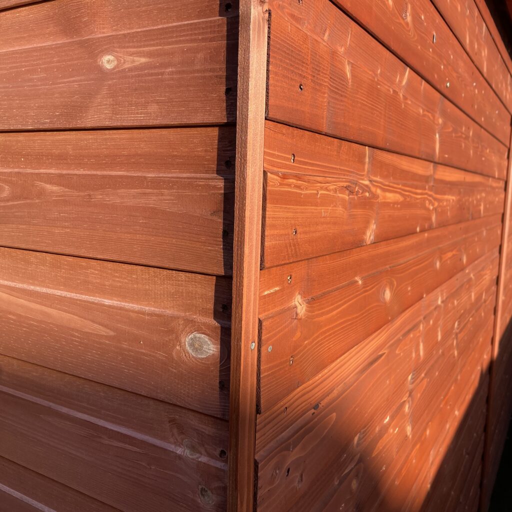 Cladding detail of the Tiger Workman Apex Shed showcasing smooth timber finish