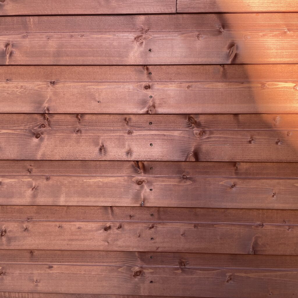 Close-up of the wooden cladding on a garden building