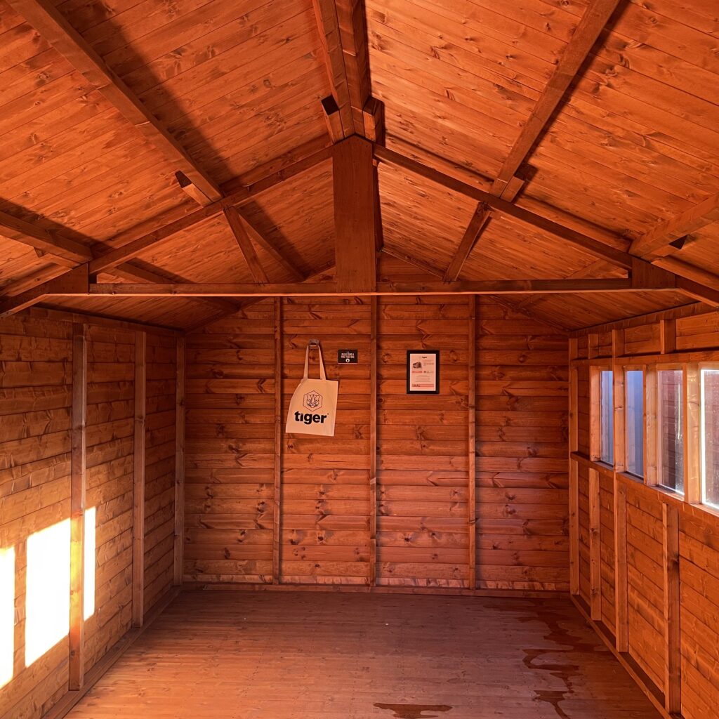 Interior view of the Tiger XL Heavyweight Workshop showcasing wooden beams and walls