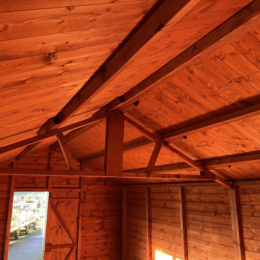 Interior view of a Tiger XL Heavyweight Workshop showing wooden beams and walls